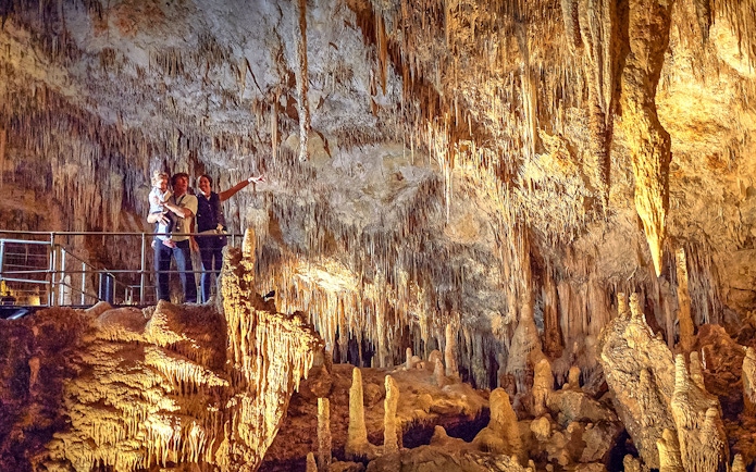 Visitors exploring stalactites and stalagmites in Mammoth Cave, Margaret River.