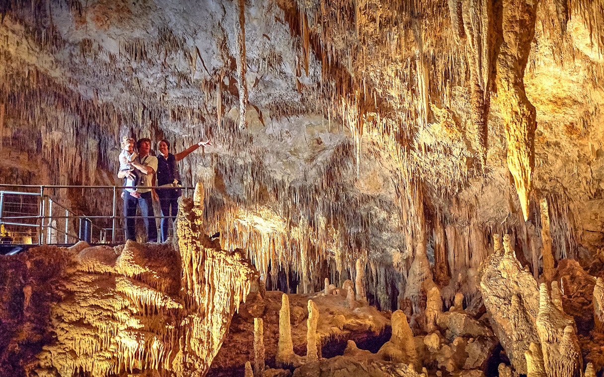 Visitors exploring stalactites and stalagmites in Mammoth Cave, Margaret River.