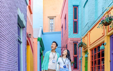 Couple exploring colorful alley at Universal Studios Hollywood.