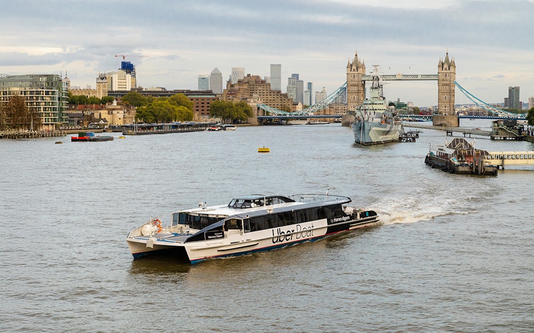 Uber Boat on Thames River near Tower Bridge, London.