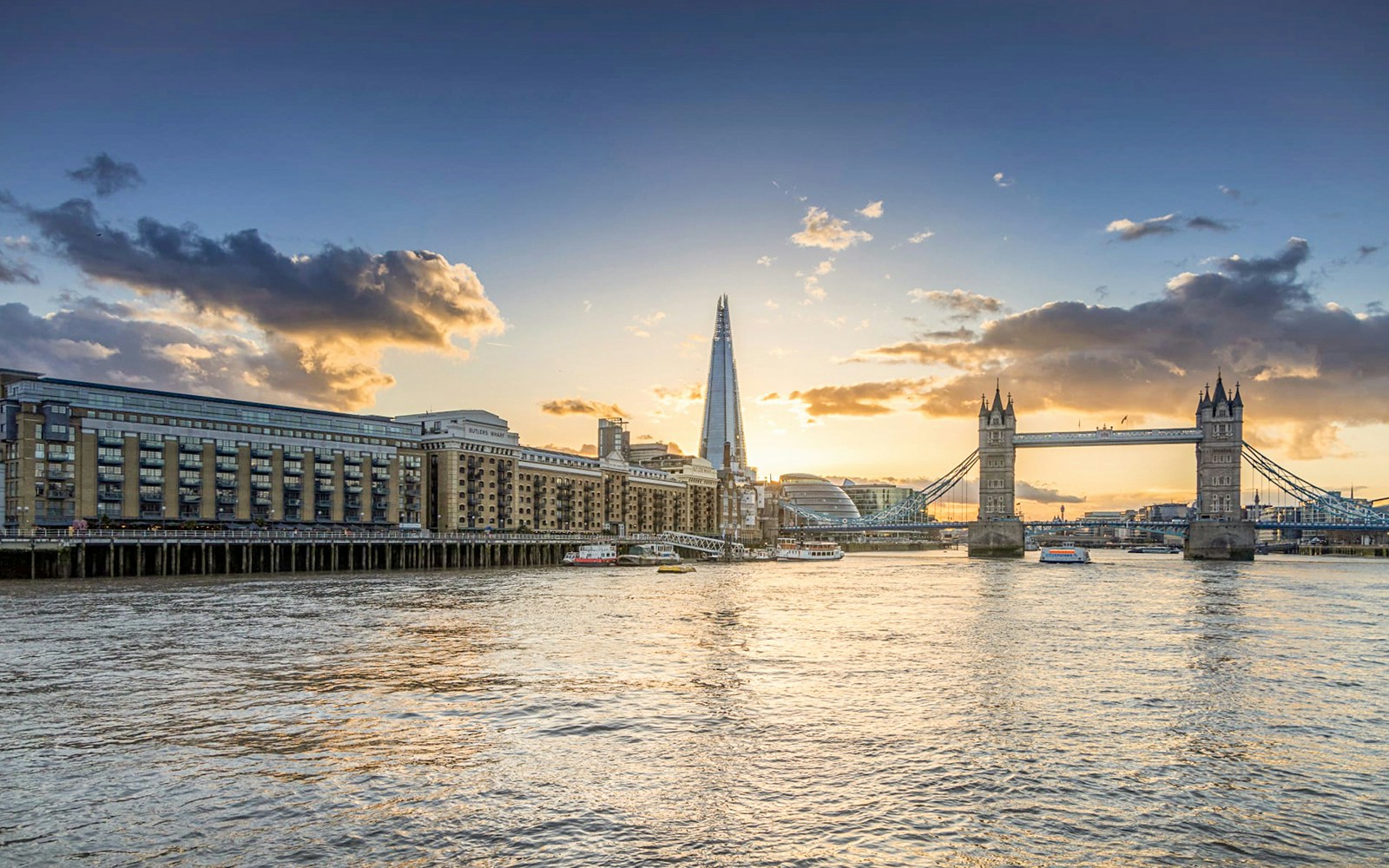 Tower Bridge and The Shard at sunset on the Thames River, London.