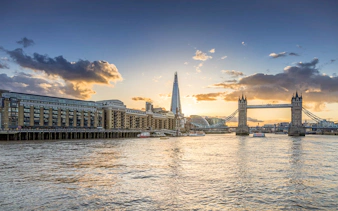 Tower Bridge and The Shard at sunset on the Thames River, London.