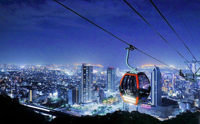 Kobe cityscape with ropeway gondola to Nunobiki Herb Gardens at night.