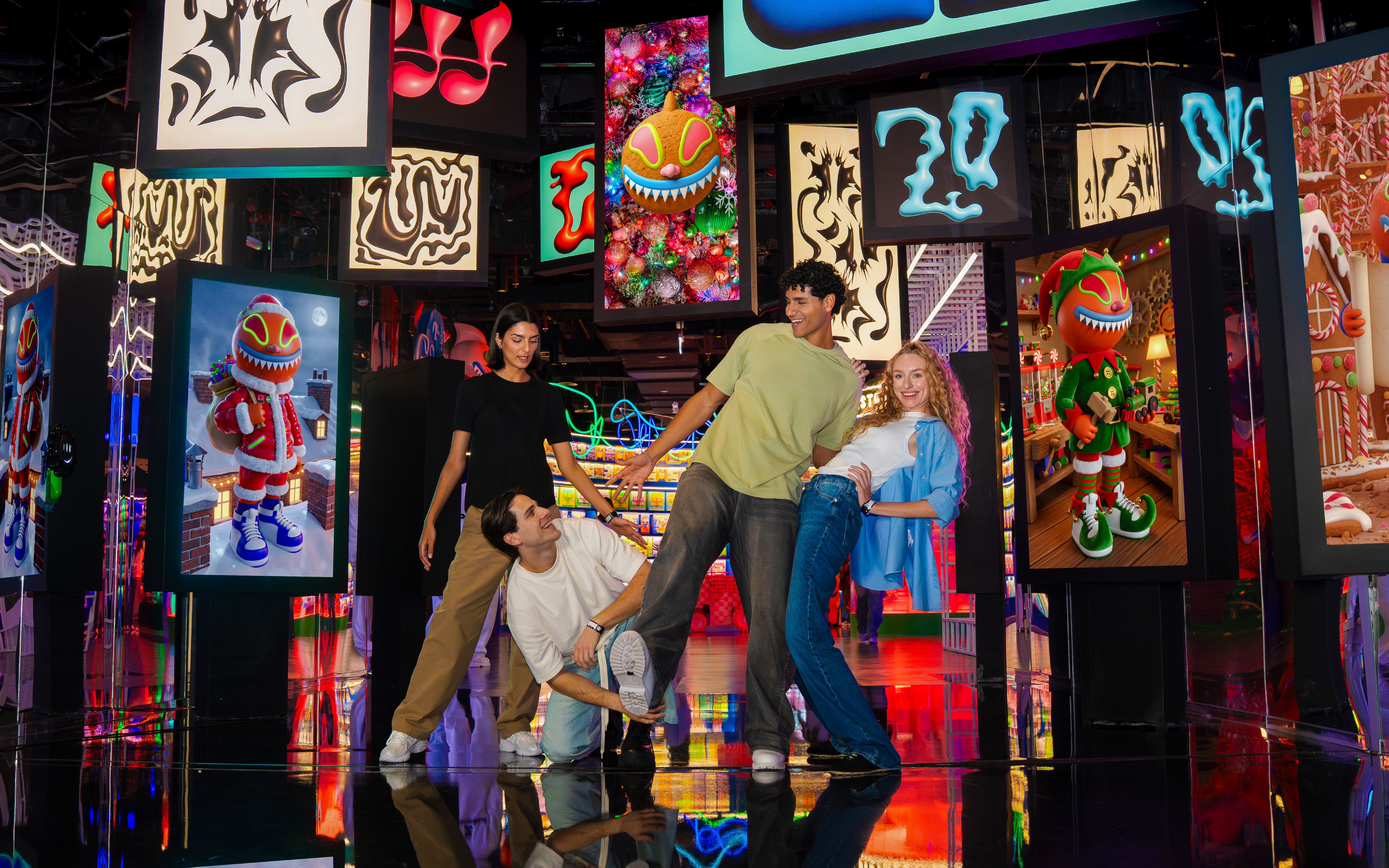 Visitors enjoying interactive displays at House of Hype, surrounded by vibrant digital art.