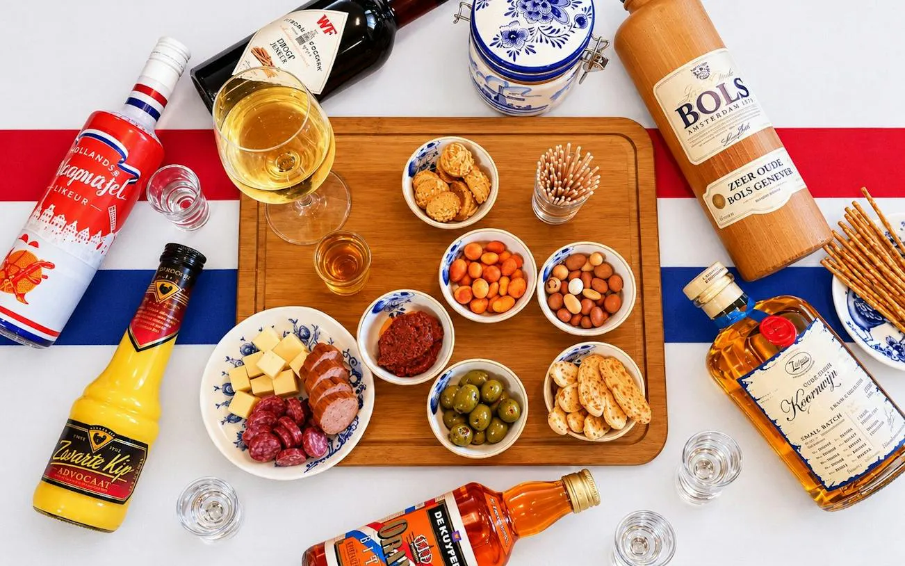 Traditional Dutch drinks and snacks on a wooden board, Amsterdam.