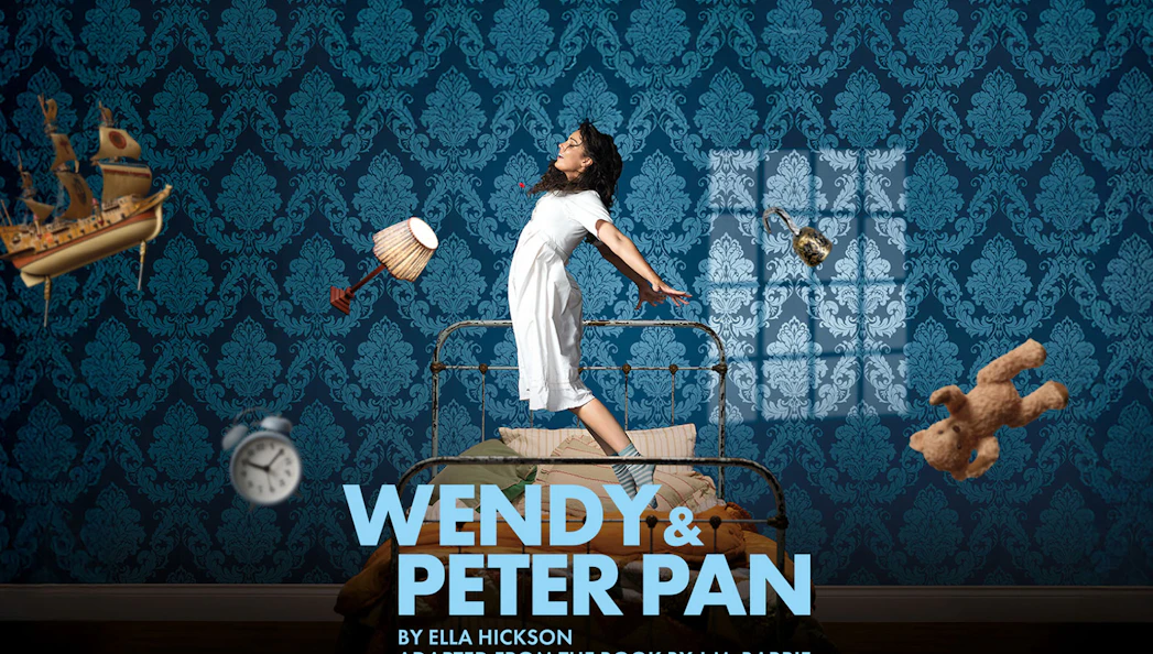 Wendy flying in a bedroom with floating objects, promoting Wendy & Peter Pan West End show.
