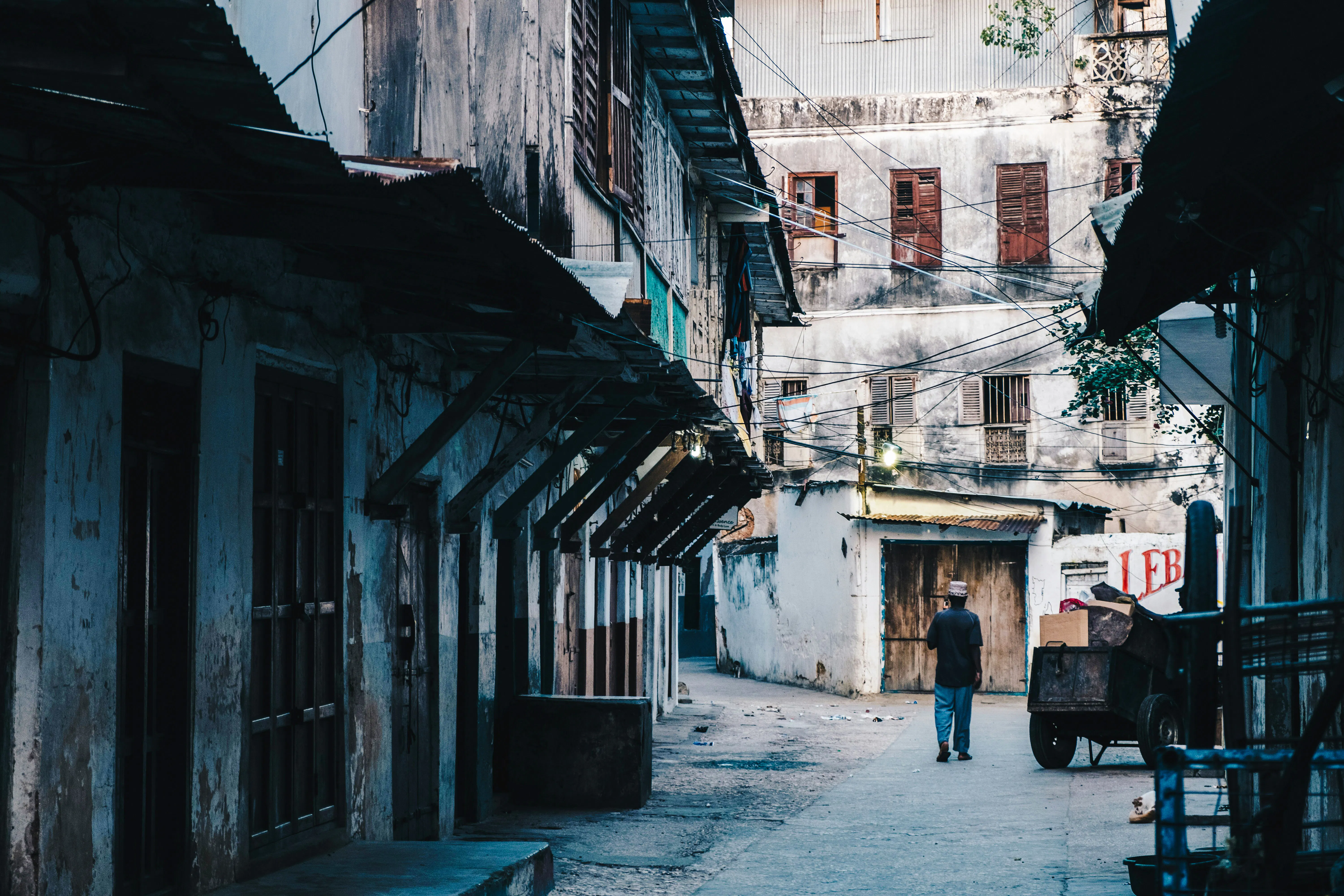Stone Town alleyway with historic buildings, part of Zanzibar full-day tour.
