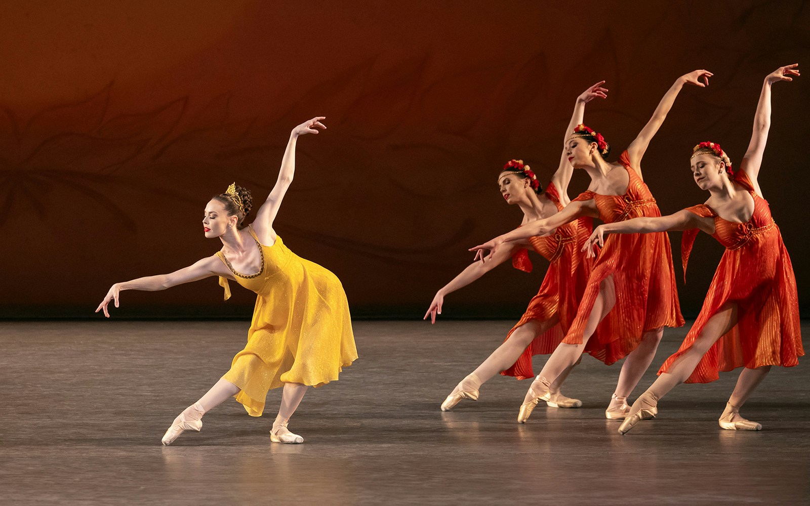 Ballet dancers performing on stage in New York City.