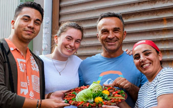 Group enjoying traditional Turkish dish on Istanbul food tour.