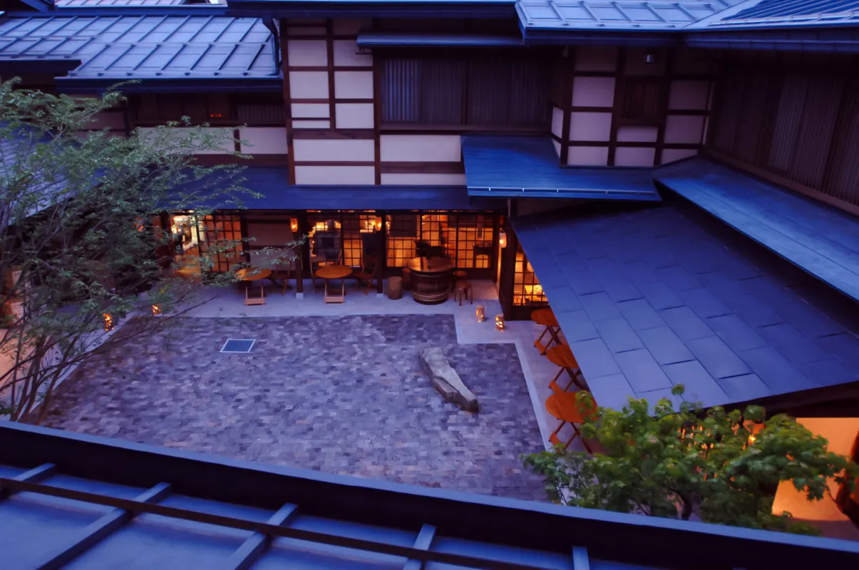 Courtyard of Funasaka Sake Brewery in Takayama, Gifu, with traditional architecture.
