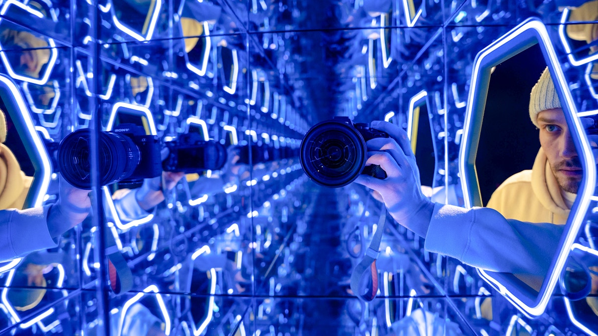 Mirrored room with neon lights at World Of Illusions exhibit.
