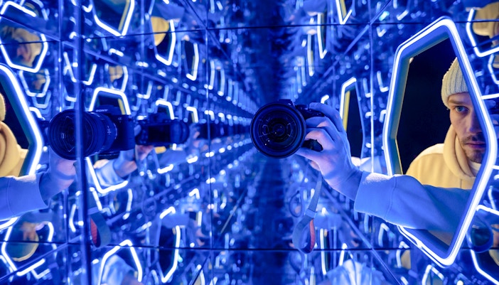 Mirrored room with neon lights at World Of Illusions exhibit.