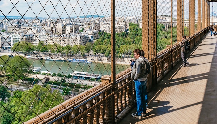 People on Second floor of Eiffel tower looking at the view of Paris