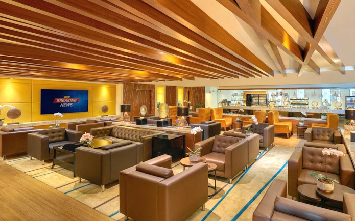 Sky Suite Airport Lounge with seating, refreshments, and amenities in Terminal 1 & 2.