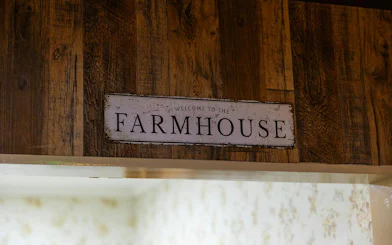 Farmhouse sign at escape room entrance, part of Premium 1-Hour Animal Tour, Brisbane.