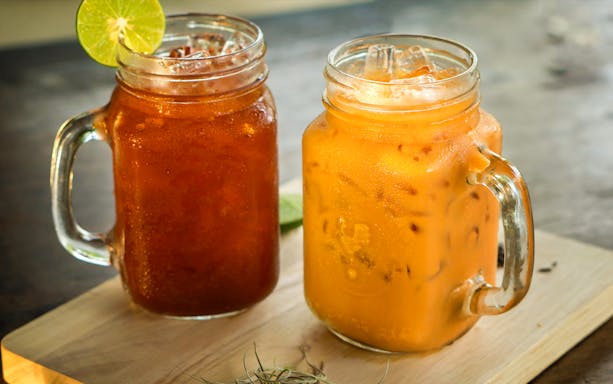 Thai iced tea and iced coffee in mason jars at Mama Noi's cooking class.