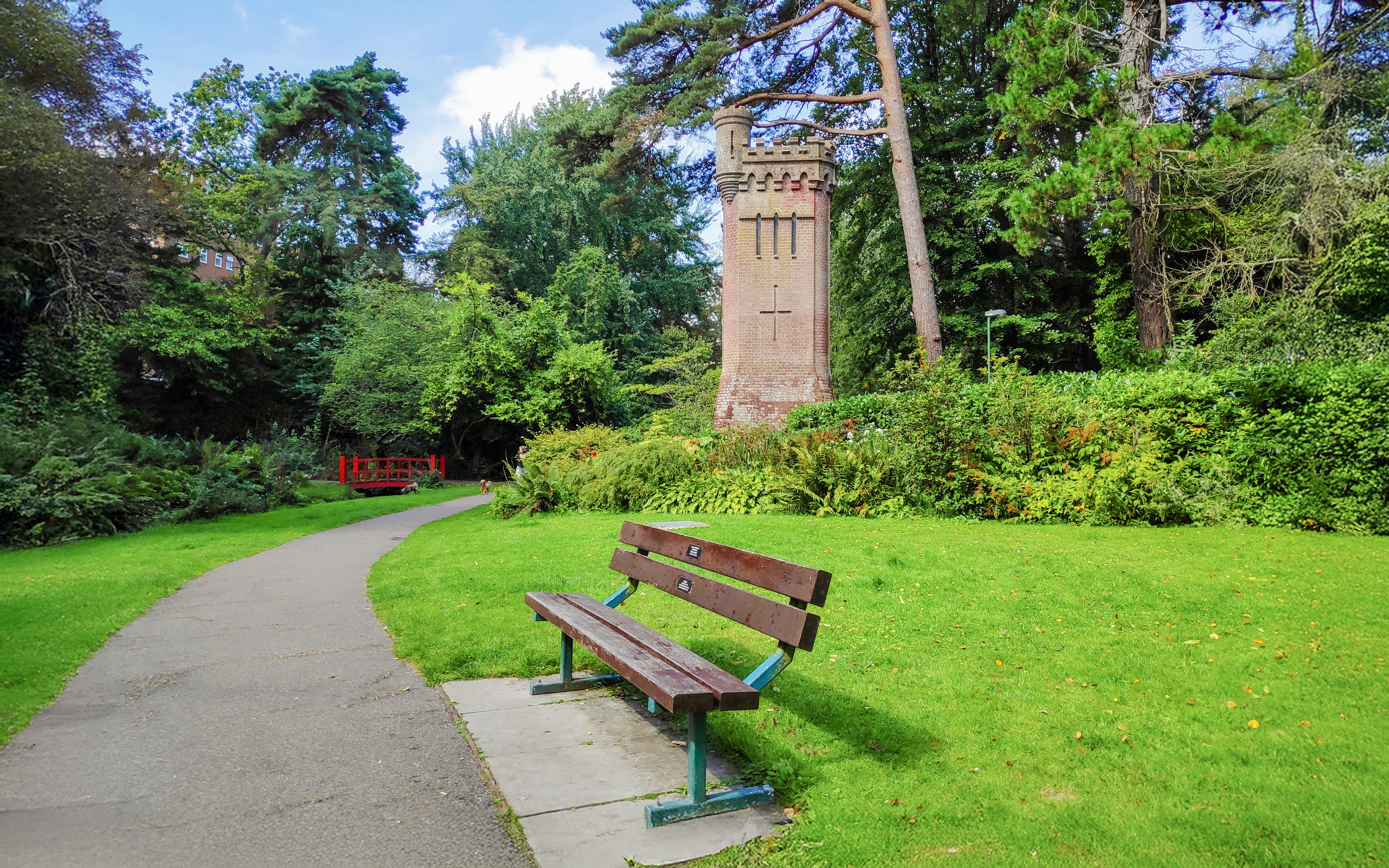 View of the green park with an empty bench, Bournemouth Upper Gardens