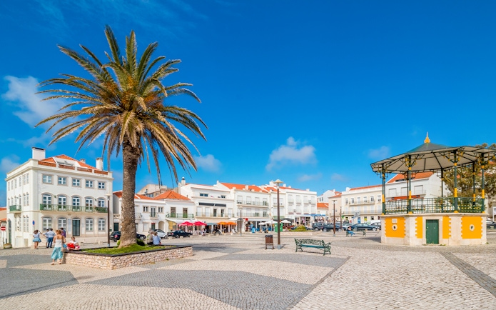 Central square of Nazaré with pavilion and Nossa Senhora da Nazaré Church, Portugal.