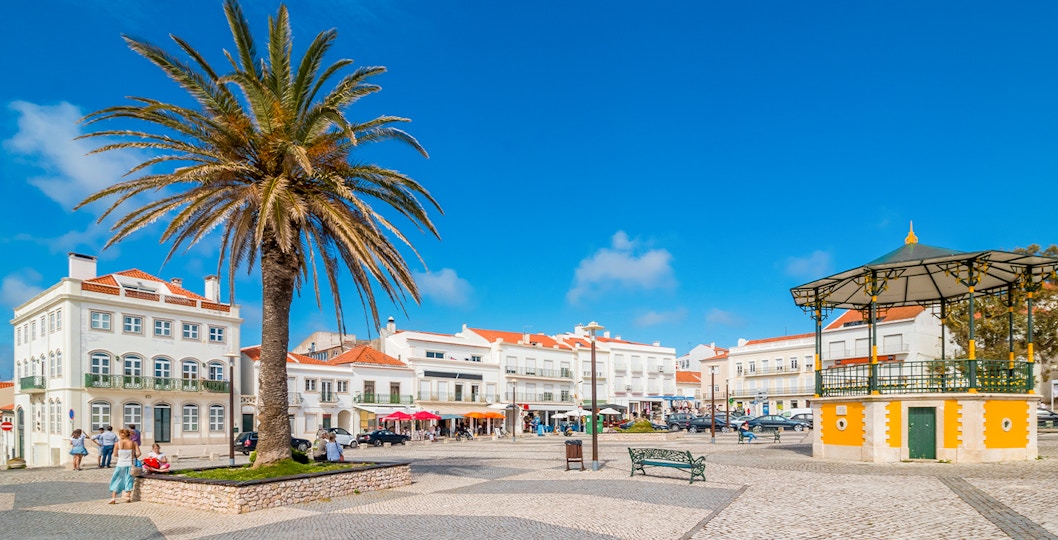 Central square of Nazare with pavilion and Nossa Senhora da Nazare Church on the background. Portugal