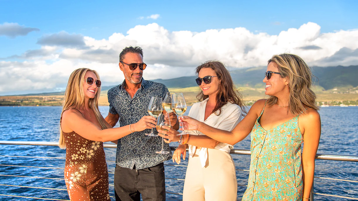 Group enjoying a toast on a luxury snorkel sail tour in Maui, Hawaii.