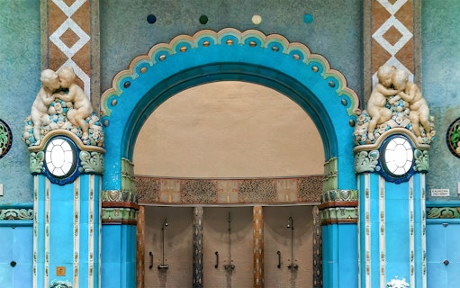 Mosaic blue tiles and ornate archway in Gellert Thermal Bath, Budapest.