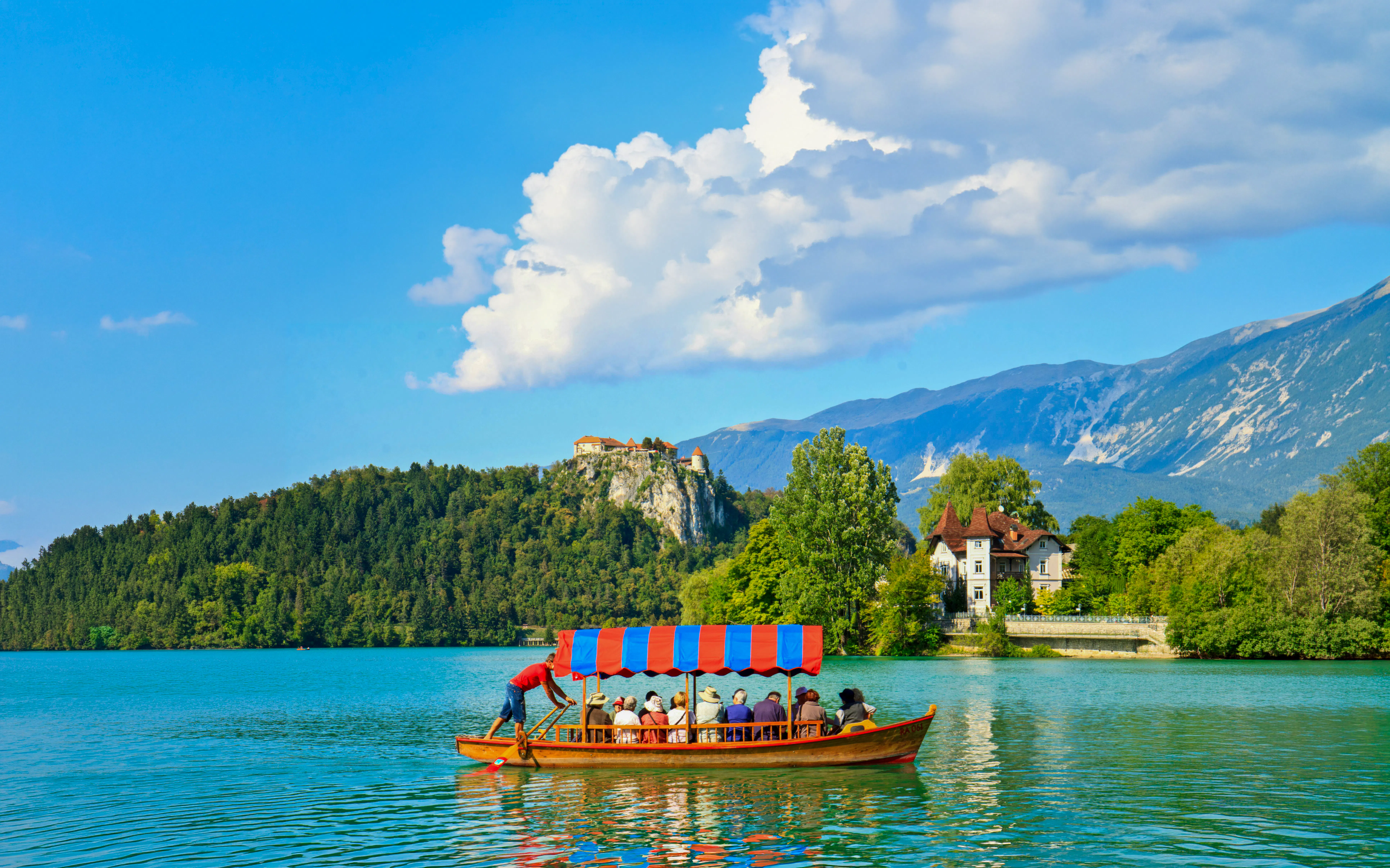 Boat on Lake Bled with Bled Castle in the background, Slovenia.