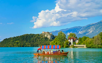 Boat on Lake Bled with Bled Castle in the background, Slovenia.