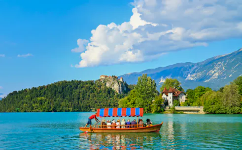 Boat on Lake Bled with Bled Castle in the background, Slovenia.