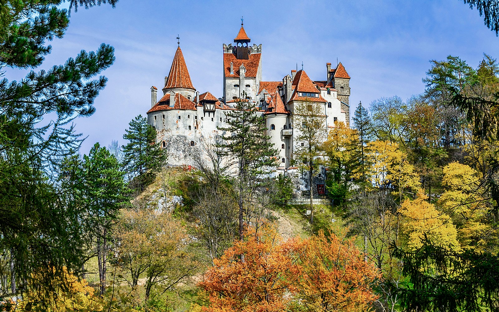 Bran Castle surrounded by autumn trees, Romania.