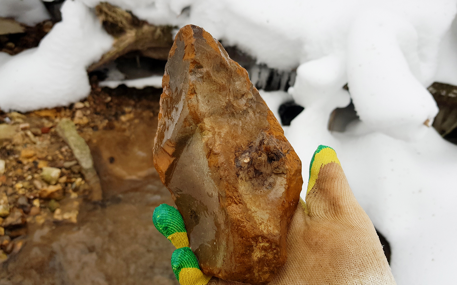 Flint in the form of a large stone axe found in a stream, an archaeological artifact of the Stone Age.