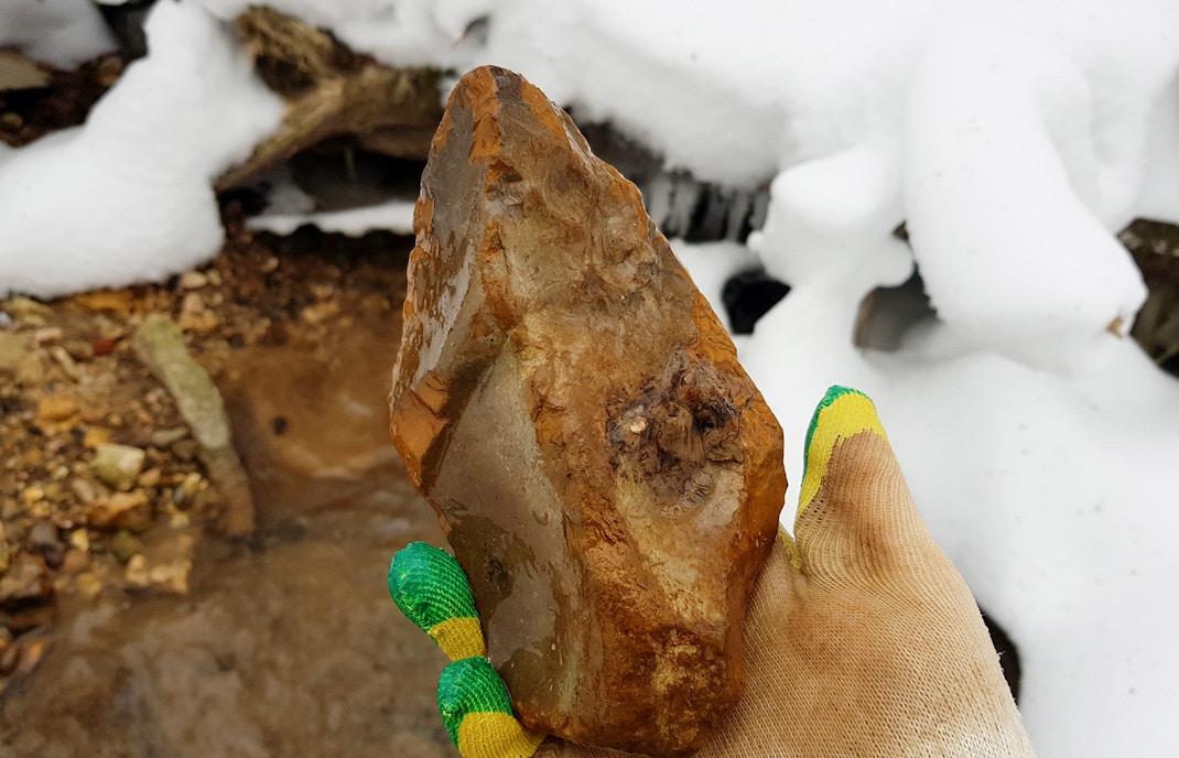 Flint in the form of a large stone axe found in a stream, an archaeological artifact of the Stone Age.