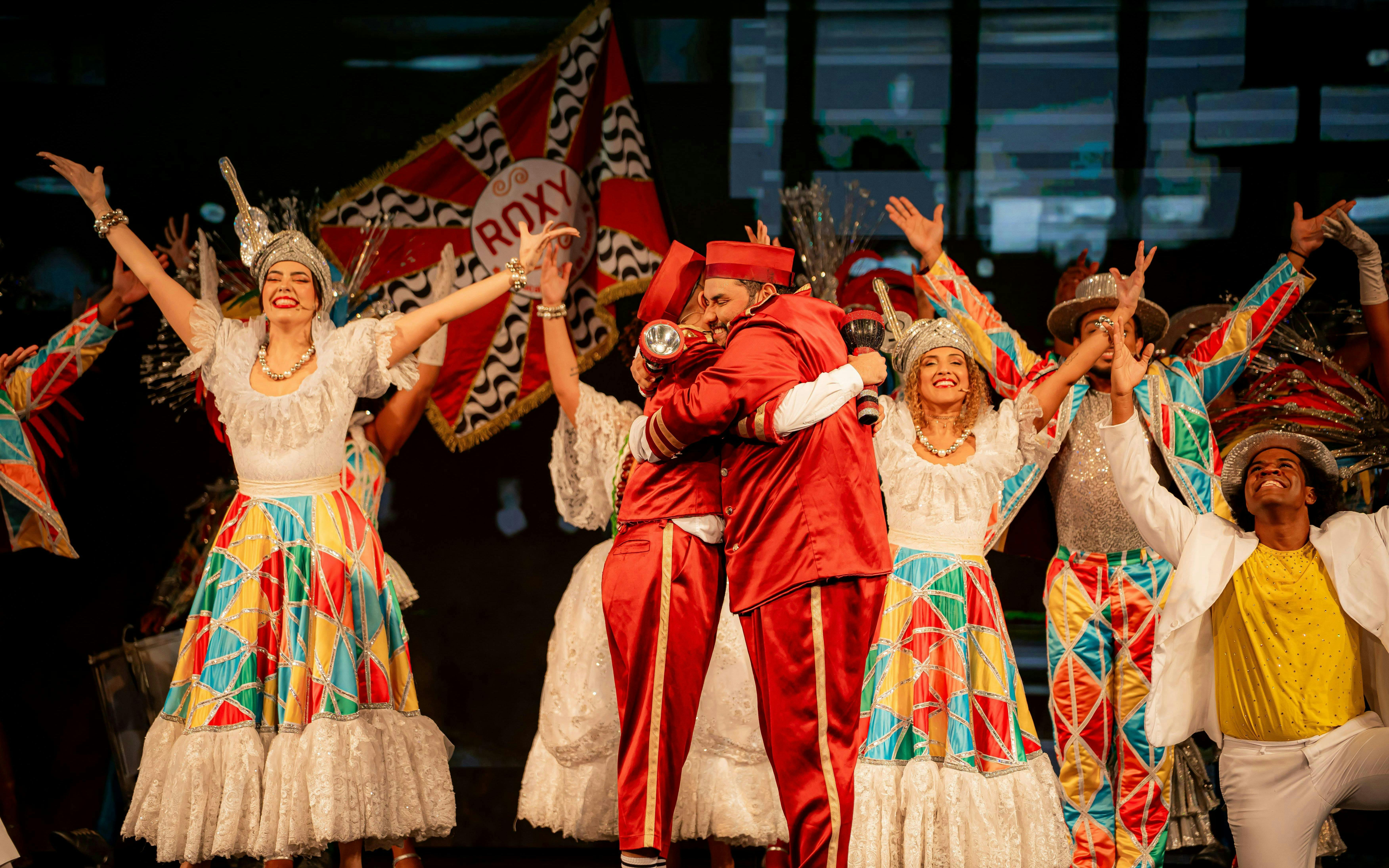 Performers in colorful costumes at Roxy Dinner Show, Rio de Janeiro.