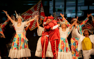 Performers in colorful costumes at Roxy Dinner Show, Rio de Janeiro.