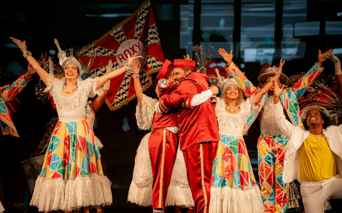 Performers in colorful costumes at Roxy Dinner Show, Rio de Janeiro.