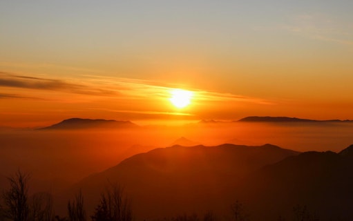 Sunset over Andes Mountains in Chile with silhouetted peaks.