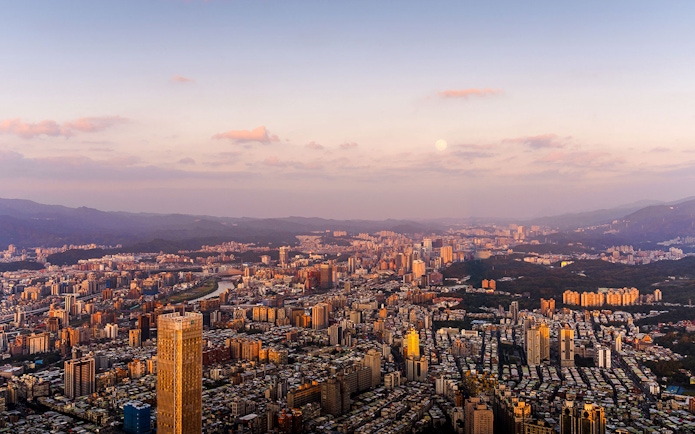Aerial view of Taipei cityscape at sunset from Taipei 101, Taiwan.