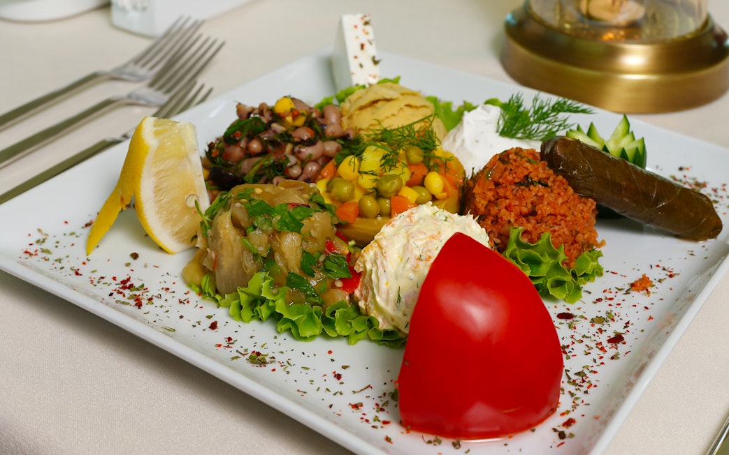 Turkish meze platter with stuffed grape leaves on Bosphorus Dinner Cruise.