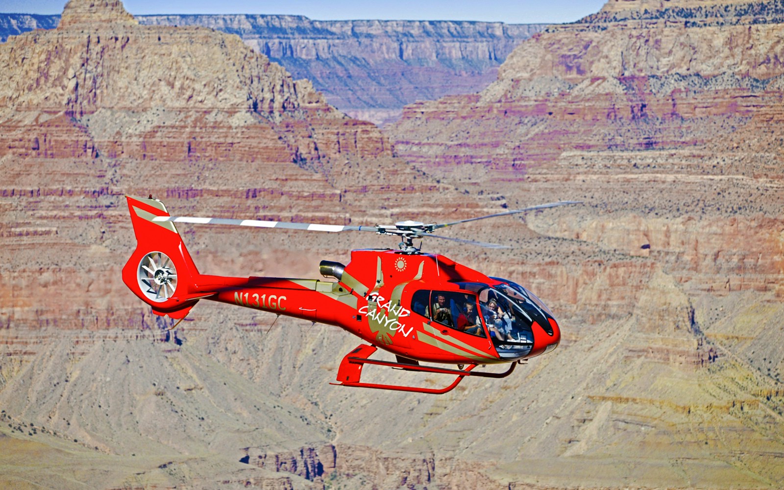 Helicopter flying over the Grand Canyon during a 45-min tour with optional Hummer excursion.