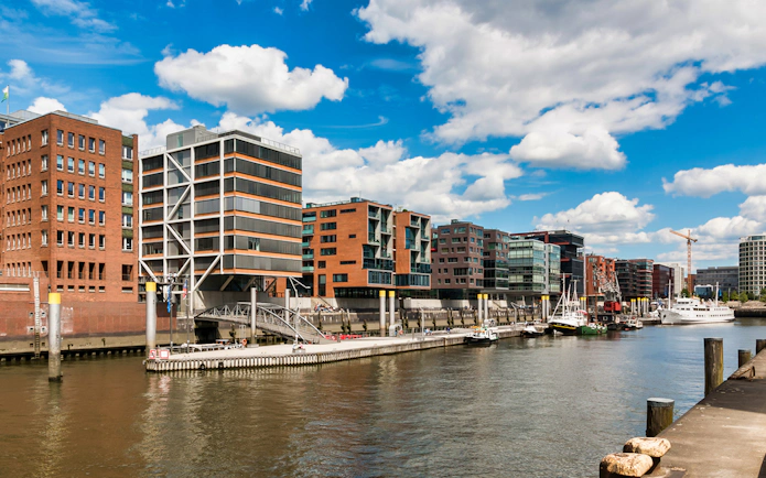 HafenCity waterfront with modern buildings and boats, Hamburg.