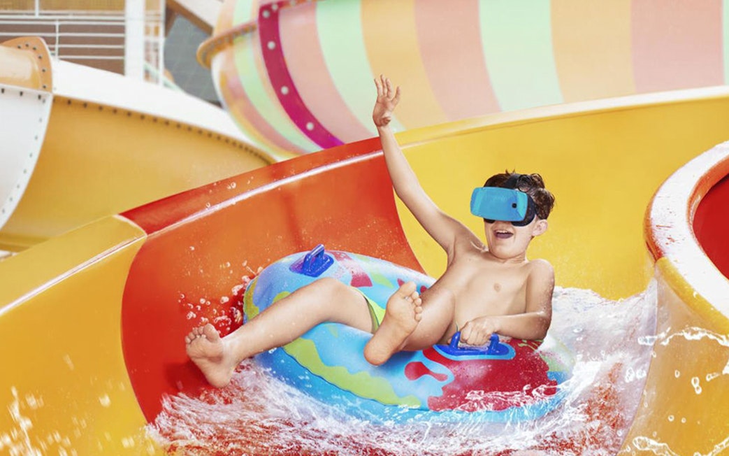 Child enjoying a water slide at Aquapalace Water World.
