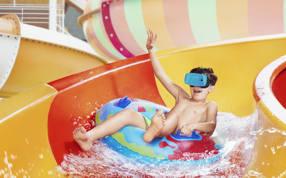 Child enjoying a water slide at Aquapalace Water World.