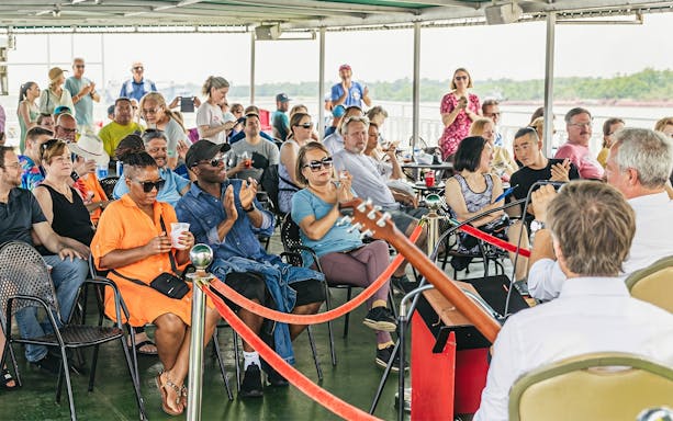 Guests enjoying live jazz music on the Riverboat City of New Orleans brunch cruise.