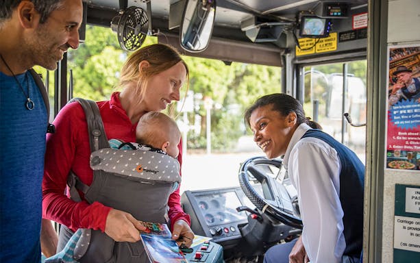 Tourists boarding a double-decker bus for a guided tour of the Blue Mountains.