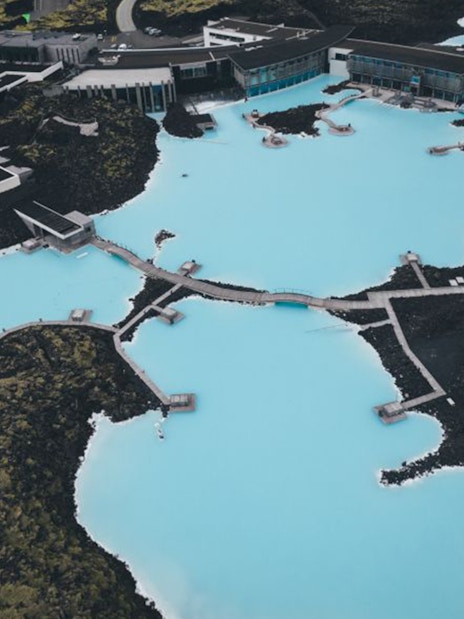 Aerial view of Blue Lagoon geothermal spa near Reykjavík, surrounded by volcanic landscape.