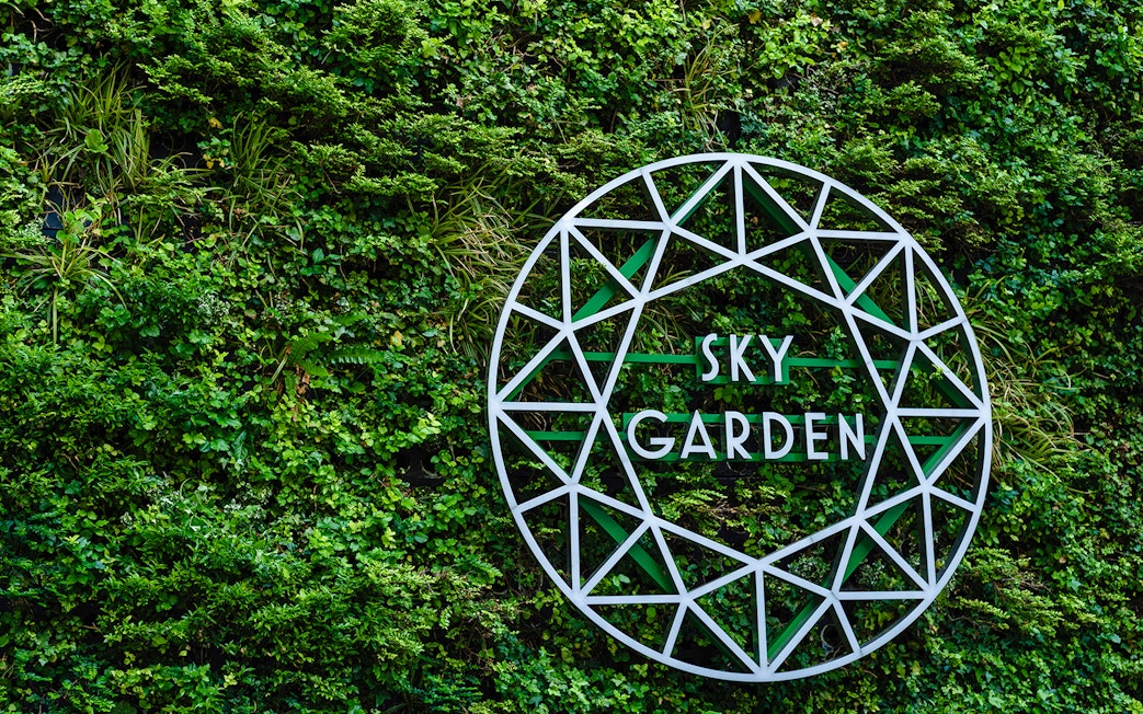 Sky Garden sign on green wall at 20 Fenchurch Street, London.