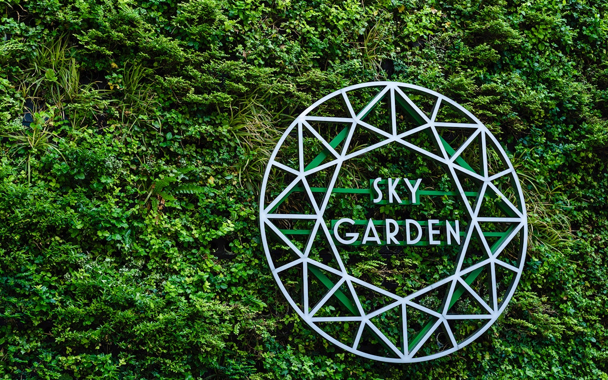 Sky Garden sign on green wall at 20 Fenchurch Street, London.