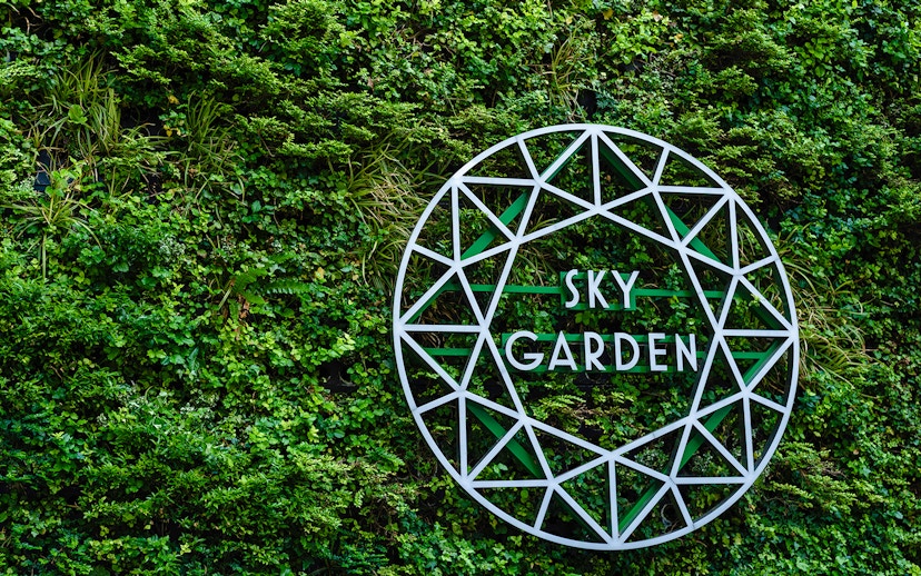 Sky Garden sign on green wall at 20 Fenchurch Street, London.