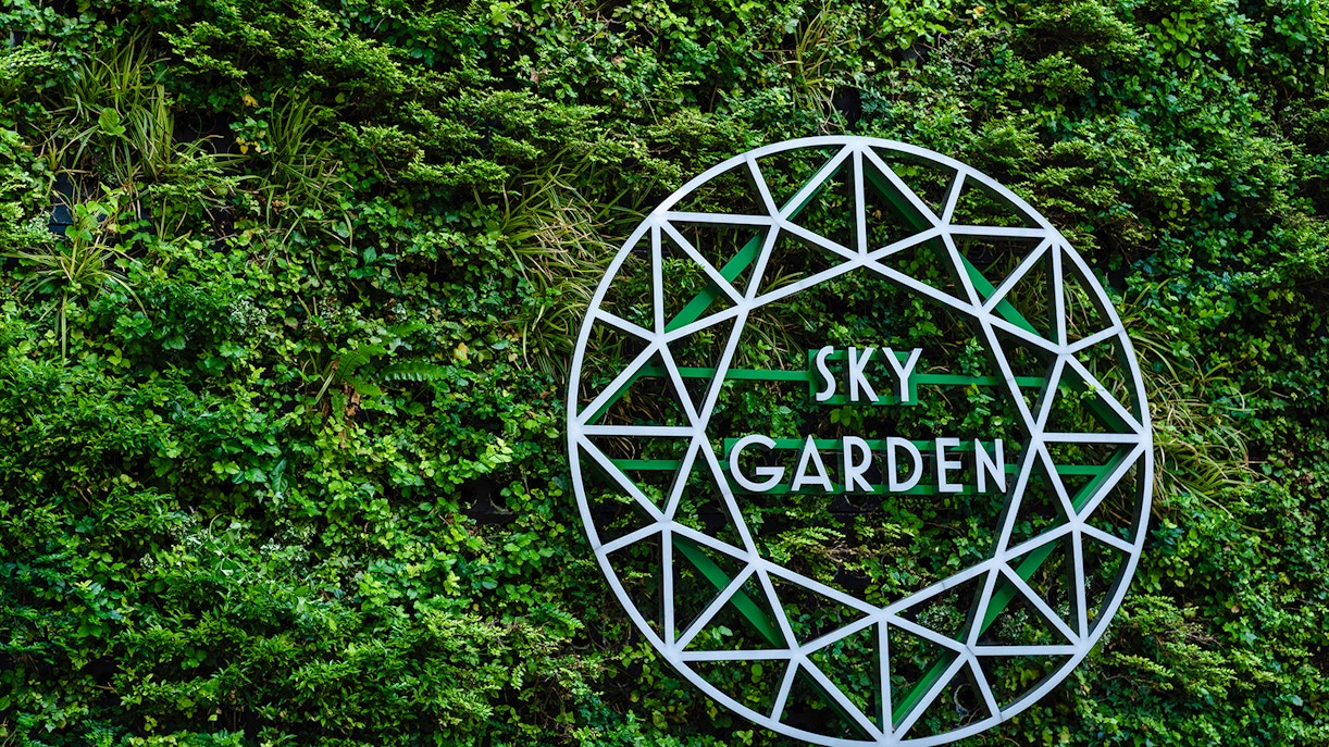 Sky Garden sign on green wall at 20 Fenchurch Street, London.