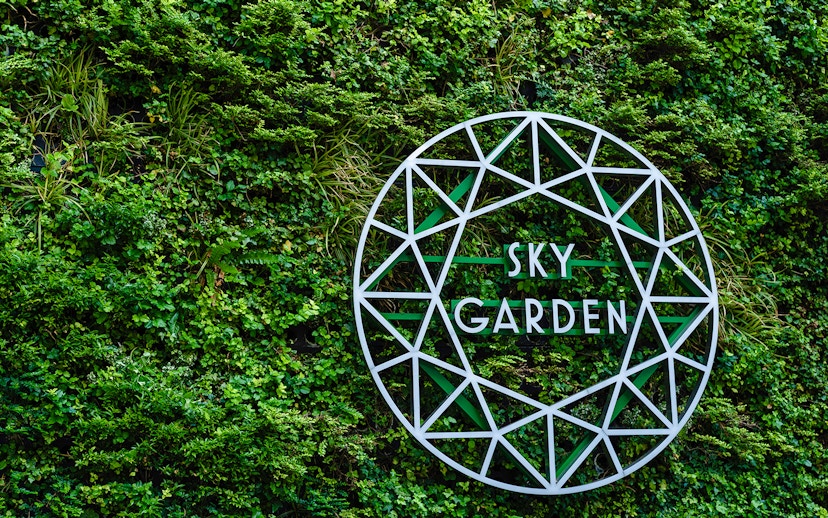 Sky Garden sign on green wall at 20 Fenchurch Street, London.