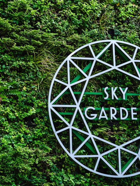 Sky Garden sign on green wall at 20 Fenchurch Street, London.